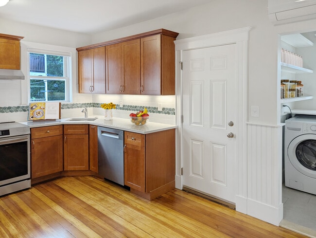 Kitchen and pantry/laundry room with in-unit washer and dryer - 22 Reed St Unit 2