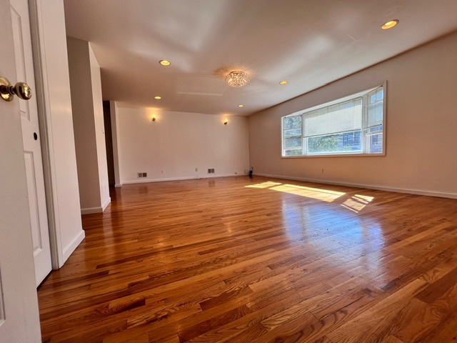 Living Room - view from front door - 119 W 35th St Apartment Unit 1st Floor