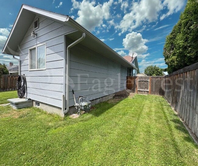Photo - Three Bedroom, Two Bathroom House with Fenced Yard and Outdoor Fireplace