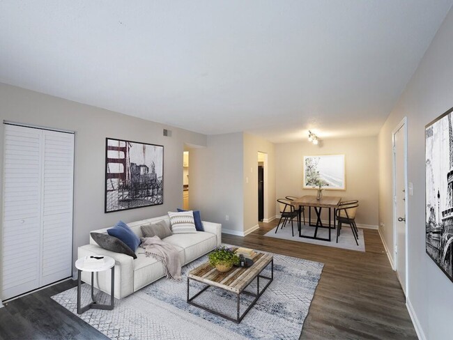 Living Room with Hardwood Style Flooring - Colony Village Apartments