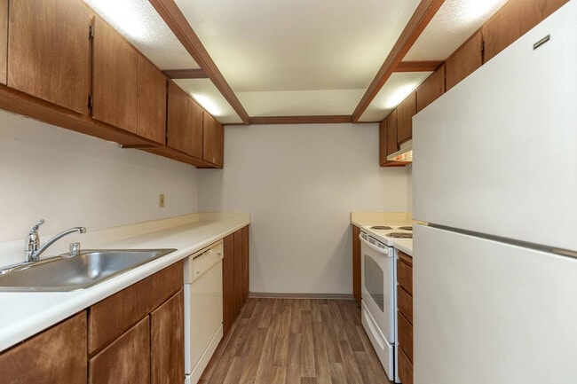 Charming Galley Kitchen at Mariposa Apartments