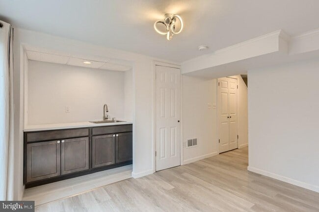 Basement with a sink - it is much bigger on the other side of the wall! - 9 Robinway Ct