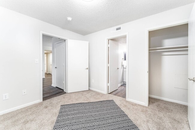 Spacious bedroom layouts at Sugar Creek Apartments in Winston-Salem, NC feature convenient en-suite bathrooms, ample closet space, and comfortable modern interiors.