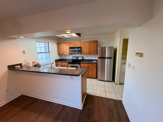 Kitchen with new fridge. - 402 Chatterton Dr Unit 402 Chatterton
