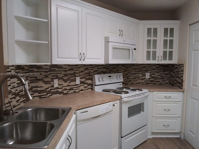 Building Photo - 6296 NW 186th St Unit 208 Rental
