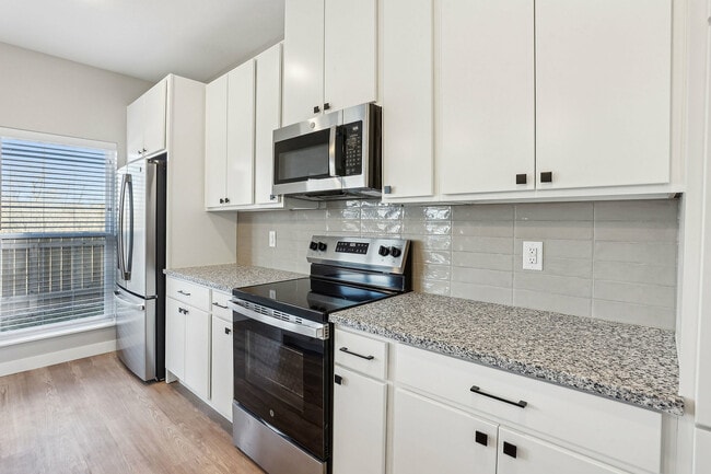 Kitchen with modern white cabinets