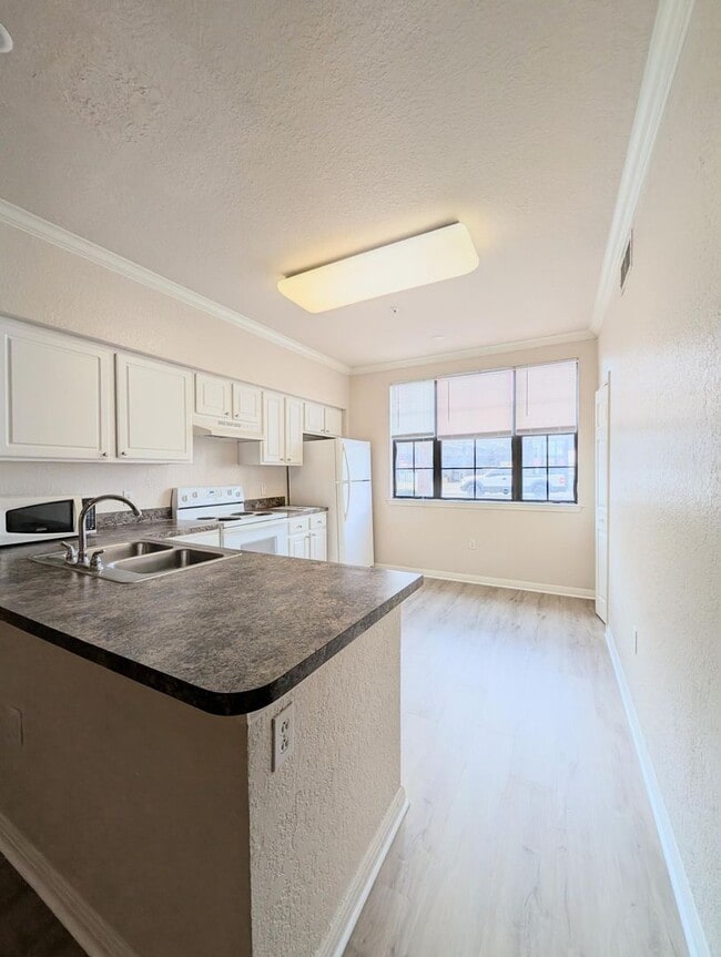 Photo - 1x1 Bright & spacious, convenient 1st floor unit. New flooring throughout, new washer/dryer & stove!