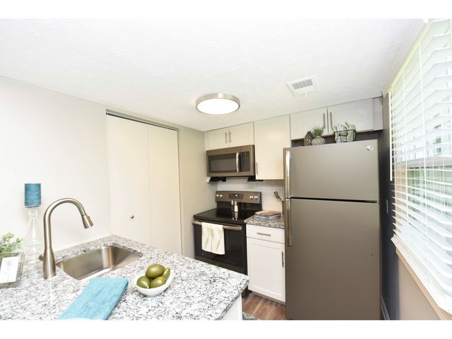 Kitchen with granite counters and stainless appliances
