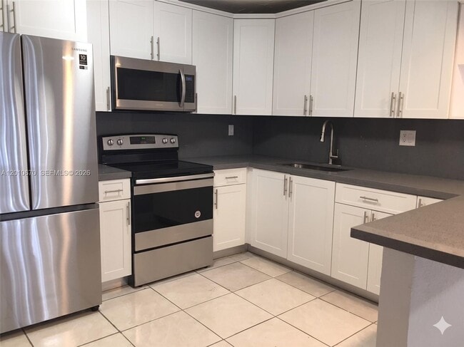 Building Photo - 8888 SW 131st Ct Unit 406