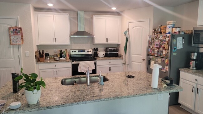 Photo - Located in Creedmore Hills a 4BR/2.5BA home with 2 car garage