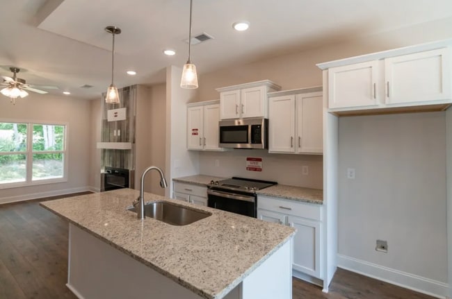 Photo - New Construction Modern Home With Open Floor Plan, Whte Cabintery and Primary Bedroom Suite