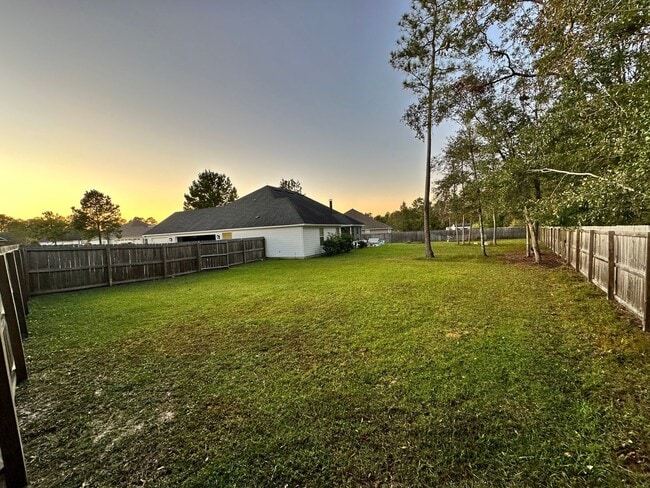 Photo - Spacious 4BR/3BA Home with 3-Car Garage, Fireplace & Fenced Yard in Knights Mill