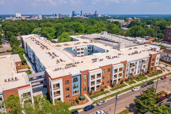 The-Edition-on-Oberlin-Raleigh-NC-Apartment-Homes-and-Townhomes-Aerial-View-of-Community-with-Downtown-Skyline