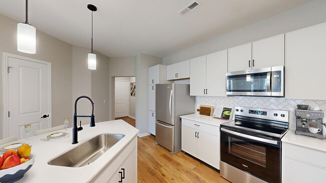 Newly Renovated Kitchen with Stainless Steel Appliances - Reveal on Cumberland Apartments