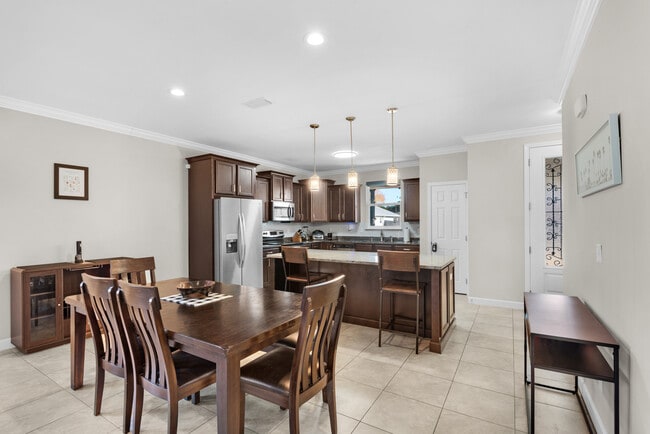 Kitchen has cooking appliances, cookware, utensils, and dishware