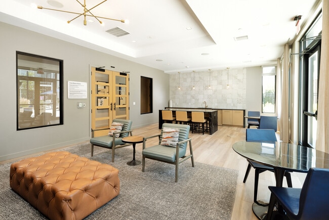 Resident lounge with seating and kitchenette