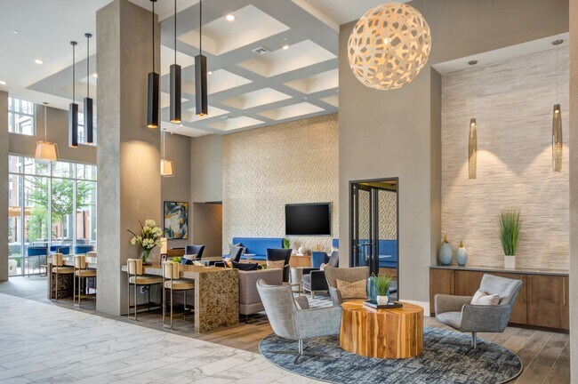 A chic and inviting lounge space featuring modern decor, cozy seating areas, and elegant lighting.