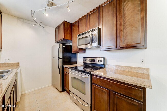 Building Photo - 14145 N 92nd St Unit 2147