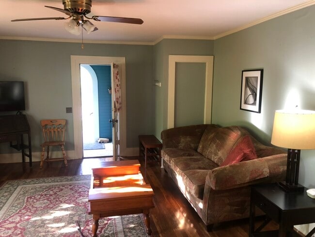 Living room is furnished with vintage & contemporary items - 412 John Adams St Unit #2 Firstfloor