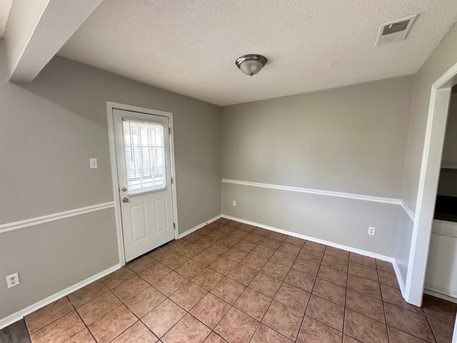 Photo - Charming 3BR/2BA Near Southwind | Soaring Vaulted Ceilings, Rustic Fireplace & Garage