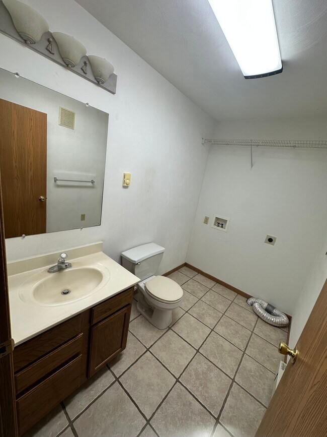 Half bath and utility hookups downstairs - 1056 Lakeshore Dr Unit 1056