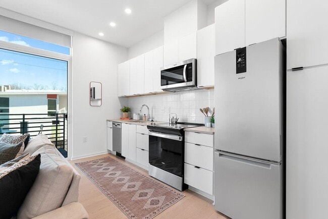 Photo - Modern downtown condo studio with private balcony & parking space.