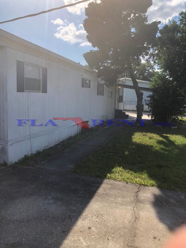 Photo - **3/1 Manufactured Home in Charlin Parkway area with large fenced yard**