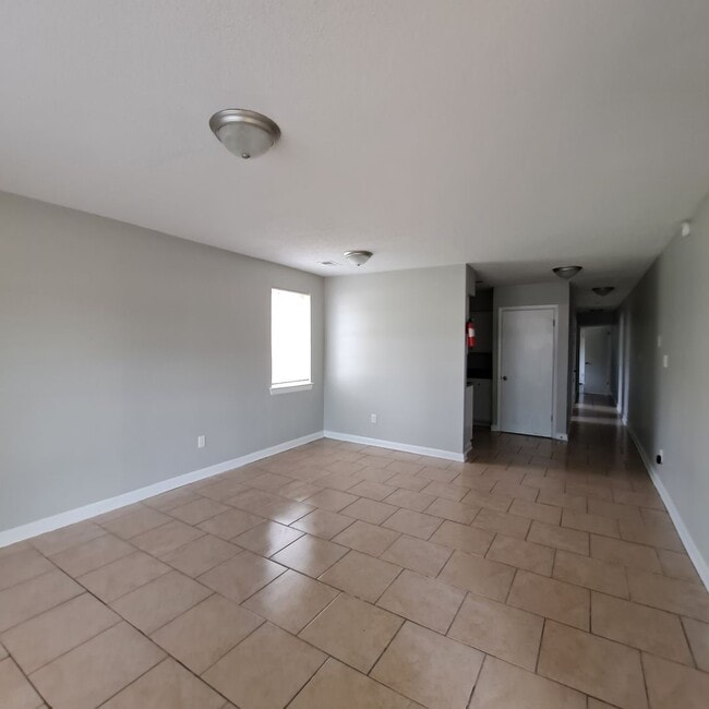 Photo - This 2BR/1BA includes a nice-sized living area, an ample kitchen, a fenced-in