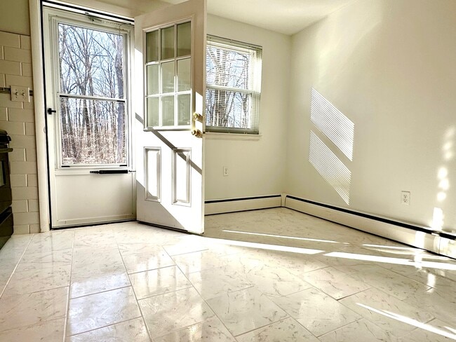 Kitchen opens to wooded yard - 1310 Slater Rd