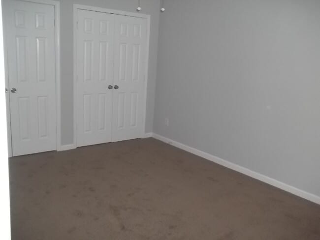 Photo - Freshly painted and new flooring in this 4 Bedroom 2 and Half Bath home. Covered front porch with...