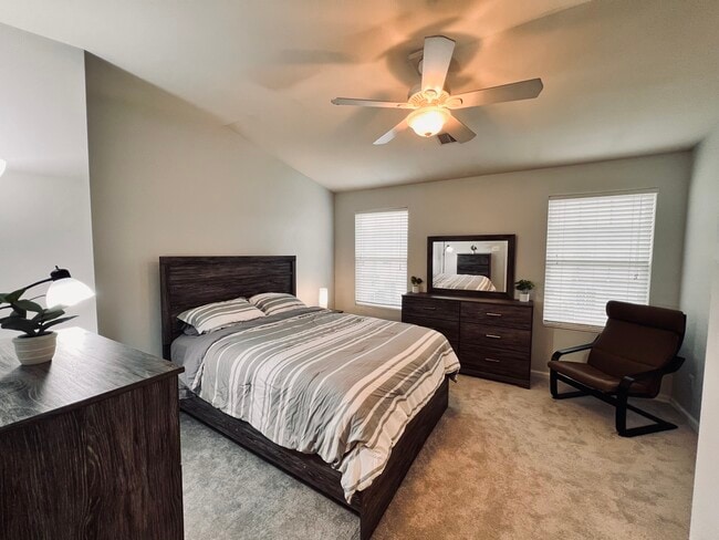 Primary bedroom with walk-in closet and full bathroom. Furnished. - 4148 Strawbridge Ct Unit Entire Home