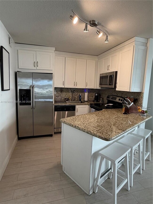 Photo - 5845 Collins Ave Unit 106