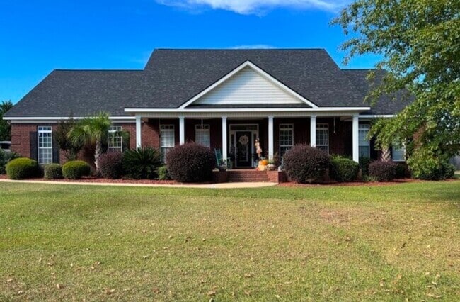 Building Photo - five bedrooms, five and a half bathrooms, a year-round heated swimming pool, and an ultimate back...