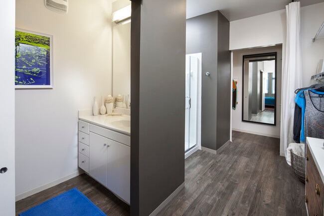 Classic Package I and II bath with white laminate countertops, white cabinetry, and hard surface flooring