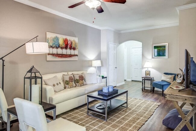Apartments for Rent in Austin TX - Open Space Living Room with Hardwood Floors, Stylish Interior, and Ceiling Fan