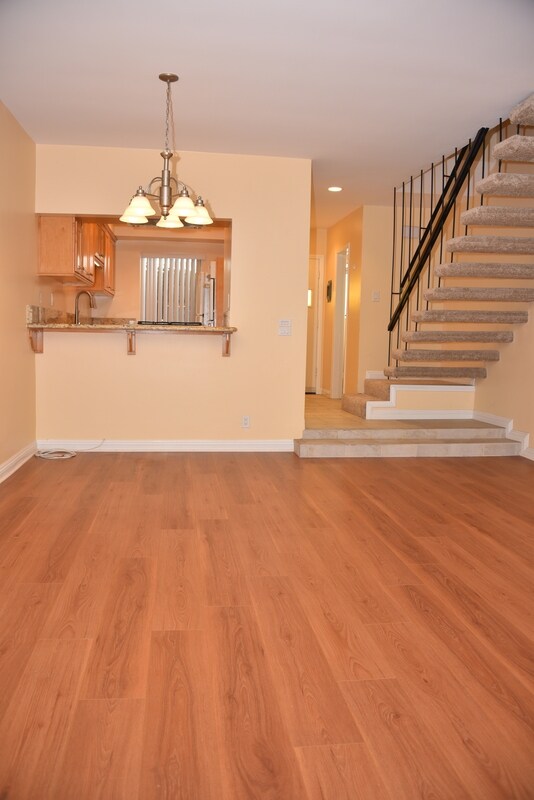 Kitchen and Staircase from LIving Room - 7711 W Manchester Ave