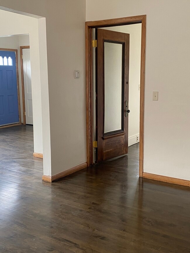 blue door leads to balcony, open door lead to stair. Photo taken from dinning room - 2550 N 45th St Apartments