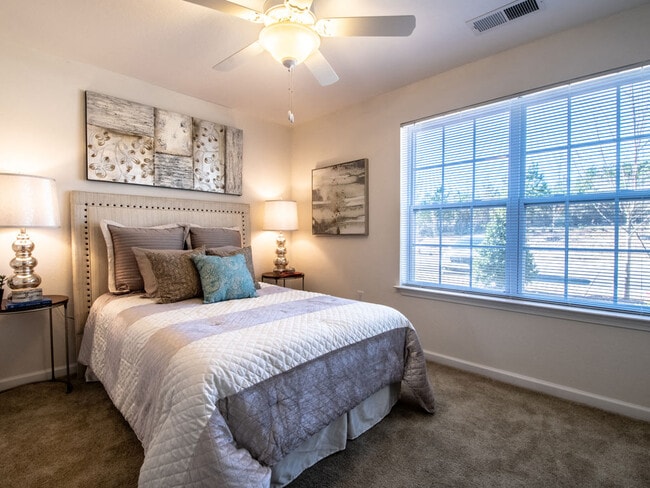 Expansive Bedroom Windows - Killian Lakes Apartments and Townhomes