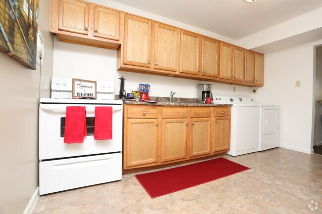 2BR, 1BA - 944 SF - Kitchen With Laundry - Eleven Oaks Apartments