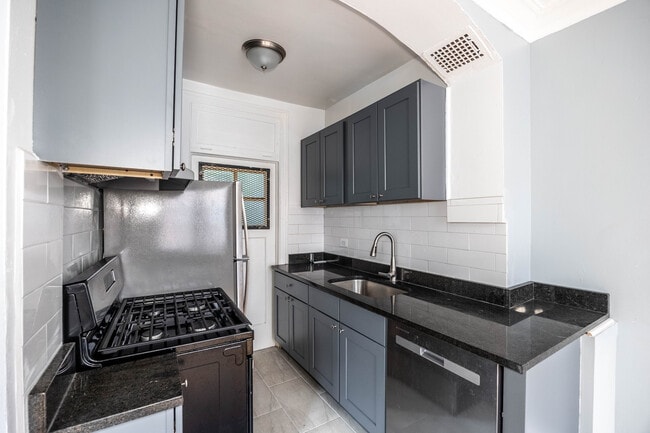 Building Photo - 1366 W Estes Ave Unit 1H