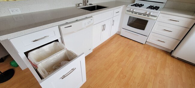 Dishwasher and Double trash bin - 4446 W 136th St Unit 2