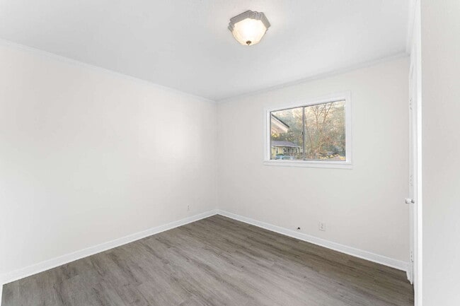 Photo - Updated 3BR/2BA Near UWF – Spacious Layout & Large Yard Unit B