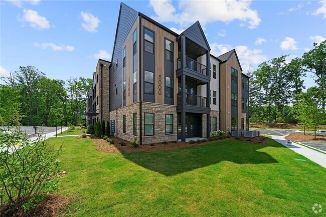 Building Photo - 7000 Renaissance Pkwy Unit B1 Rental