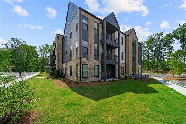 Building Photo - 7000 Renaissance Pkwy Unit B1 Rental