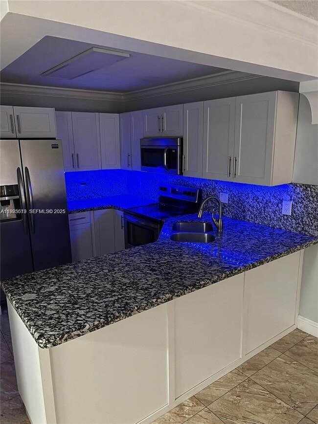 Building Photo - 1075 W 68th St Unit 218