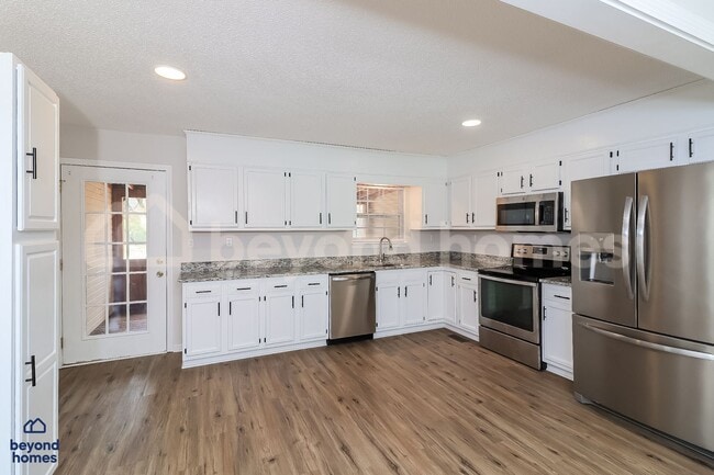 Photo - Gorgeous 4 bedroom / 3 full bath with 1,670 sq feet of space!