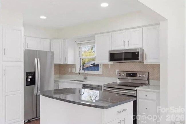 Photo - "Discover Comfort and Space in Charlotte: 4-Bed, 3-Bath Gem on Red Carriage Lane!"