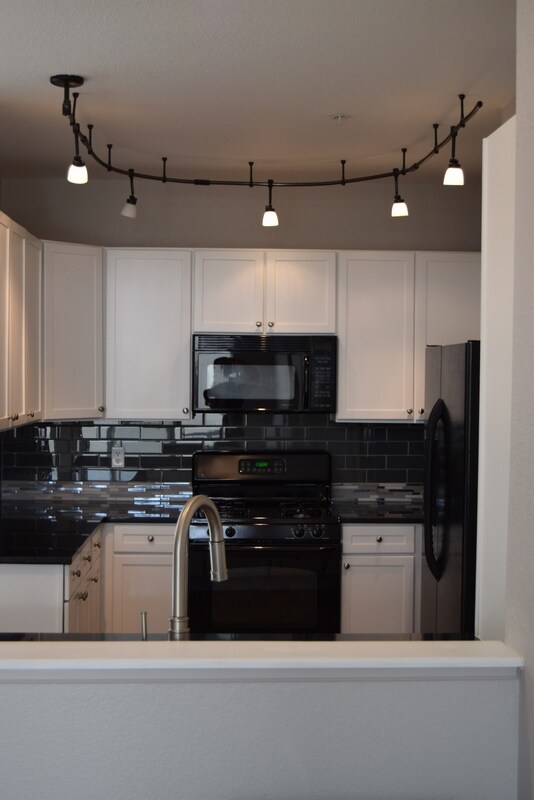 Updated tile in the black and white kitchen - 9079 E. Panorama Circle Unidad 404