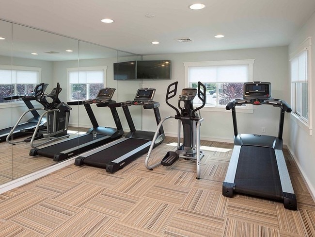 Fitness center at Yardley Crossing with two treadmills and an elliptical machine
