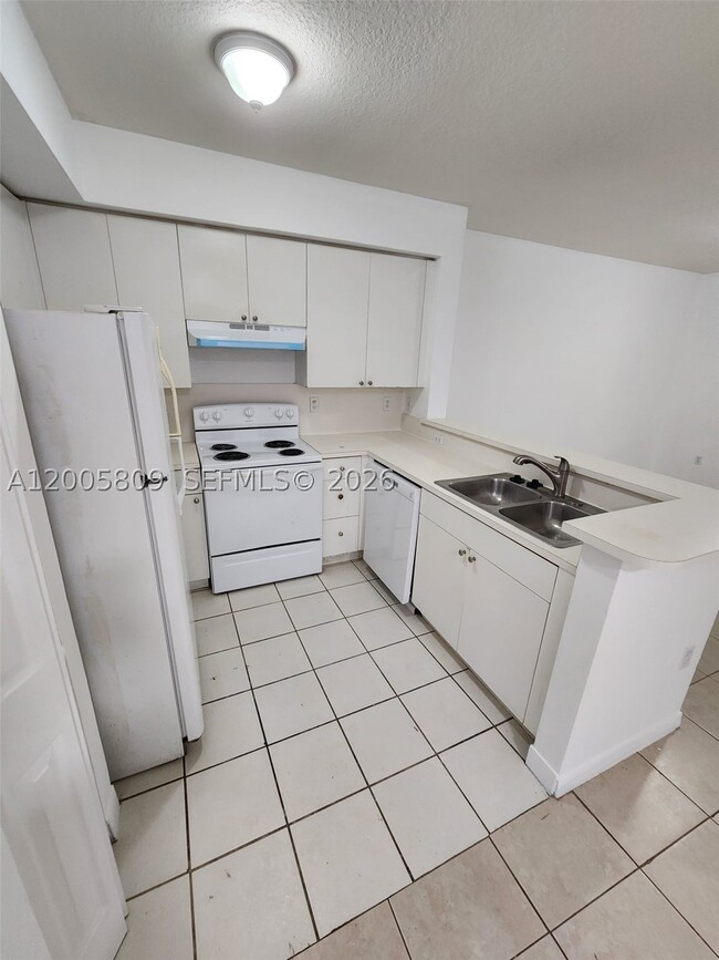 Building Photo - 11060 SW 196th St Unit 209